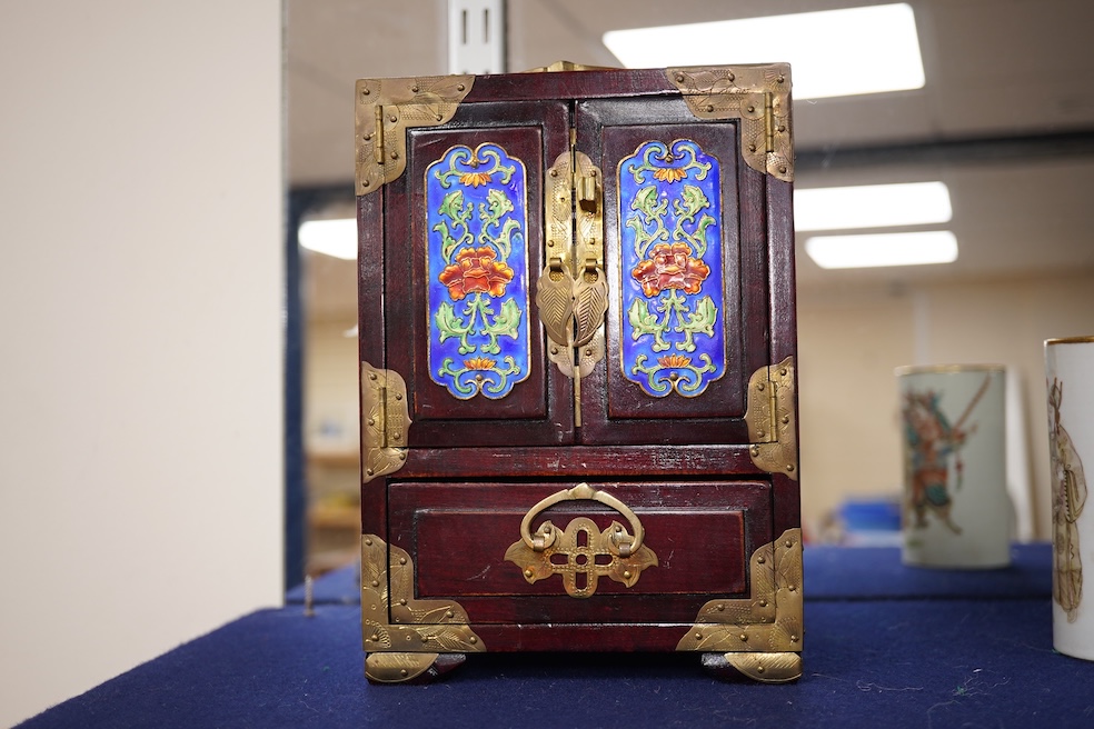 A Chinese brass mounted jewellery cabinet, decorated with enamel plaques. 21cm high. Condition - generally good